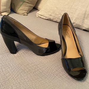 Black and grey patent leather heels.